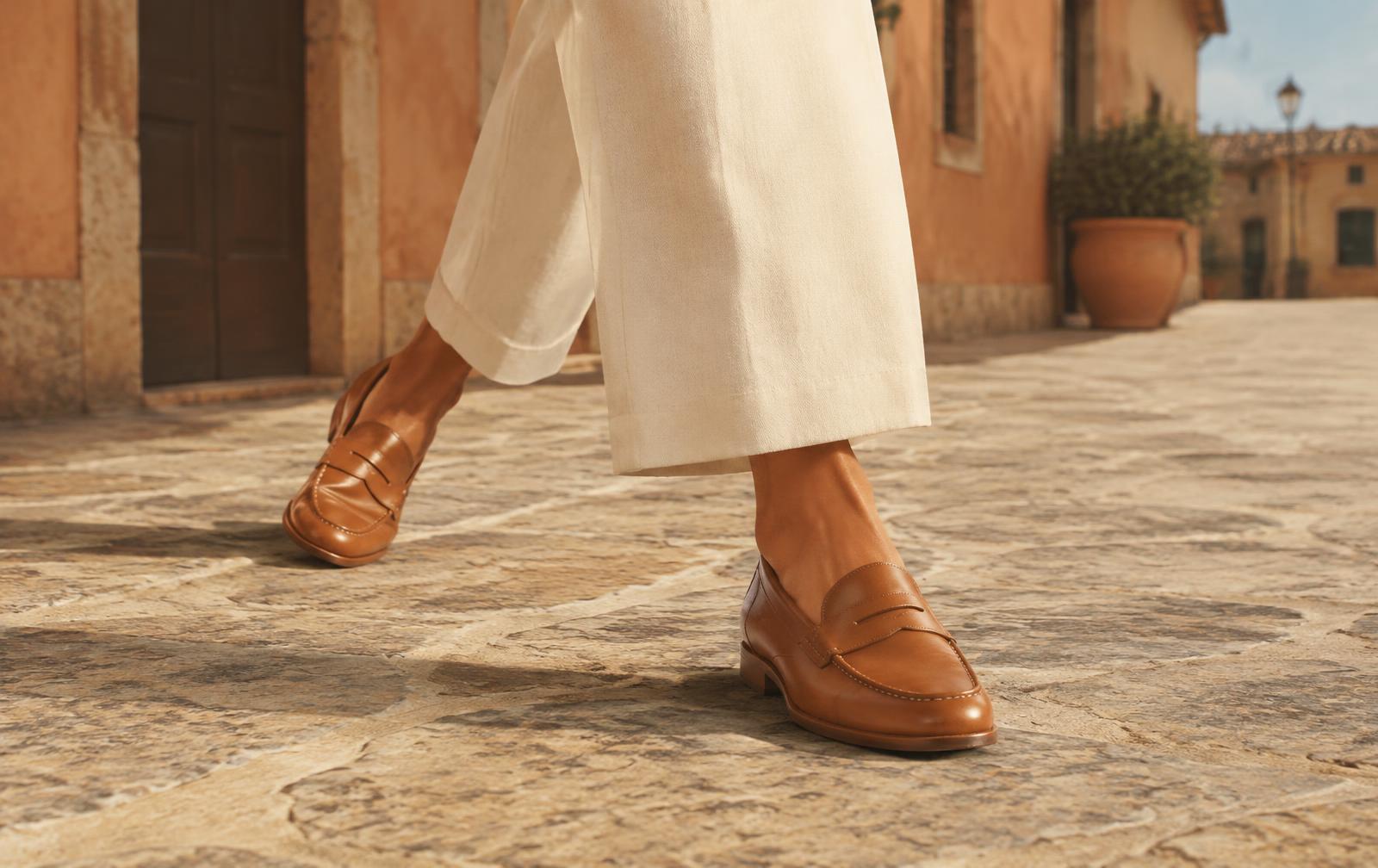 Woman walking in Averra loafers on an Italian street